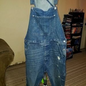Mens distressed denim overalls.